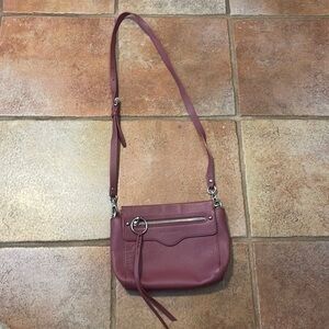 Rebecca Minkoff Crossbody tassel zip bag in plum color